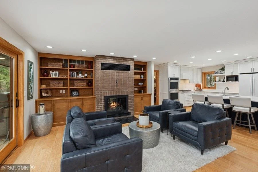Built ins in the family room with wood burning fireplace.