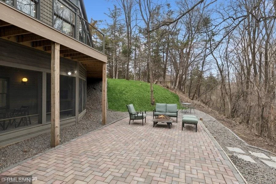 There are so many options to sit and enjoy the amazing views of this home!   This paver patio is located on the  walkout level on the back of the home!