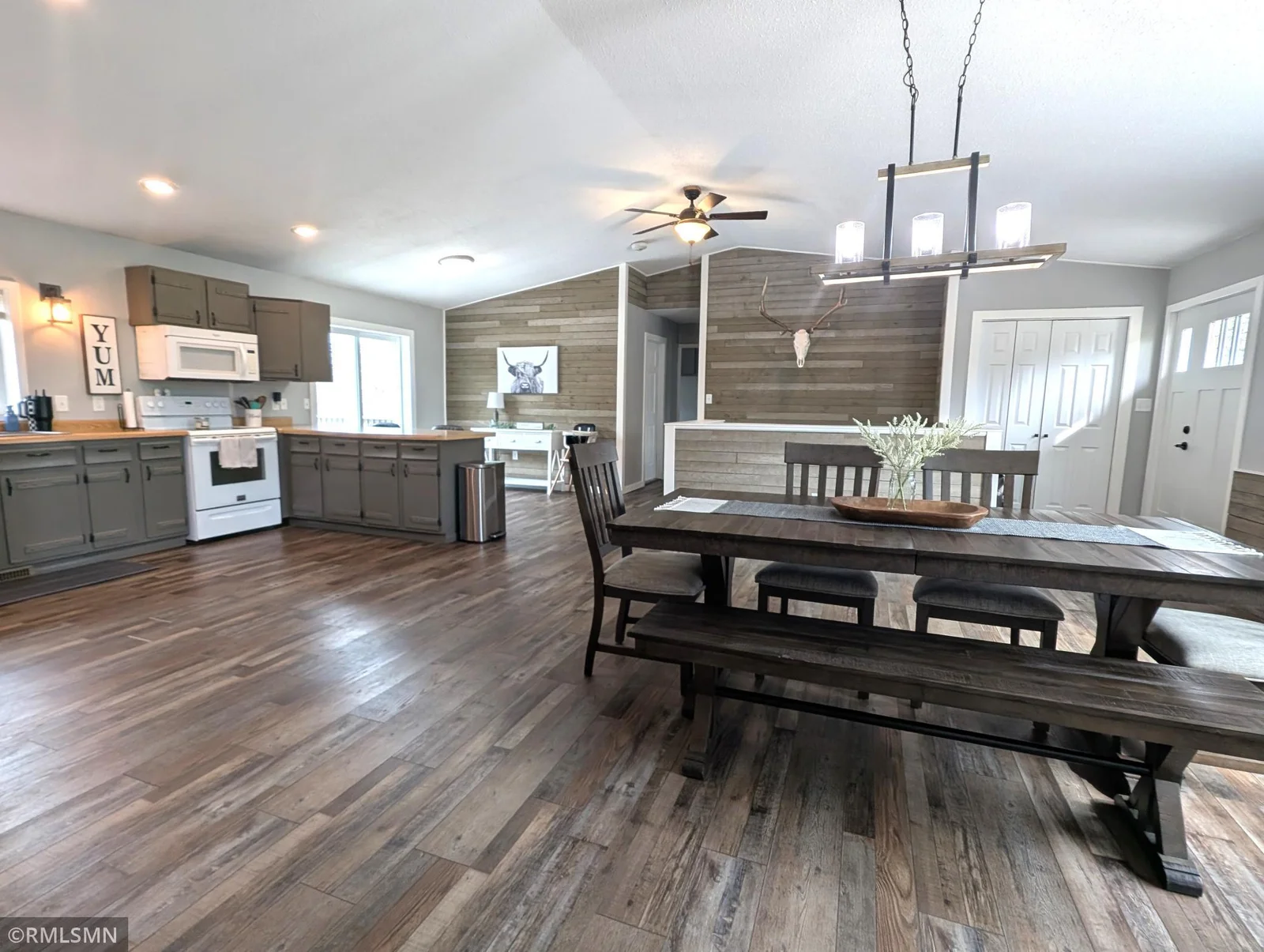 Beautiful open concept kitchen and dining with vaulted ceiling