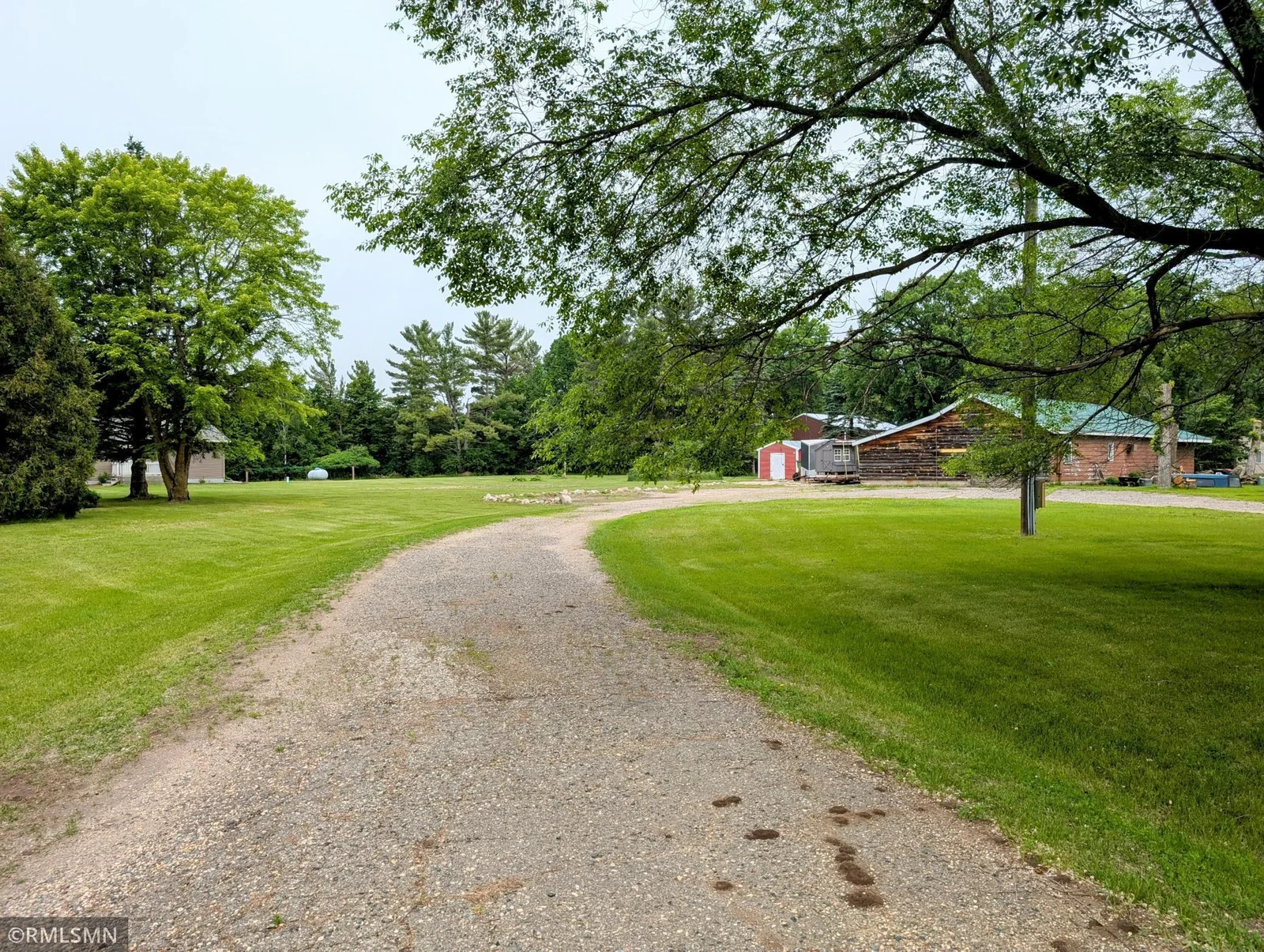 Driveway splits to home and to the sheds