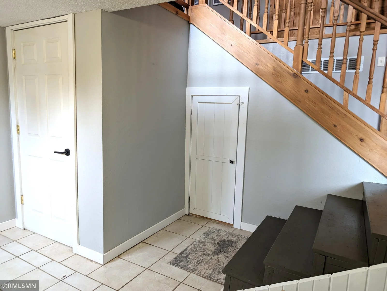 Storage closet and door to the attached garage
