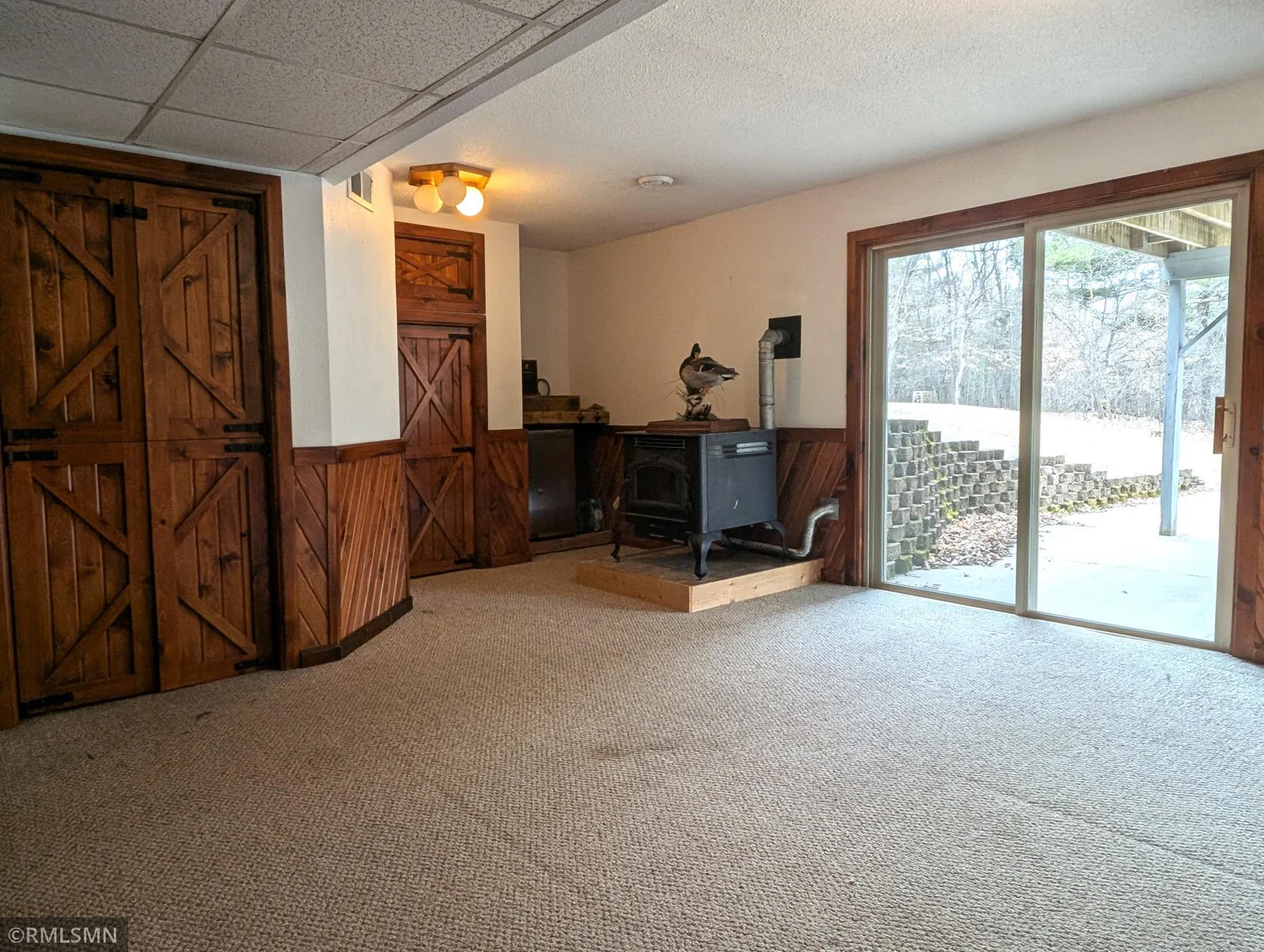 Lower level family room with sliding doors to patio and backyard