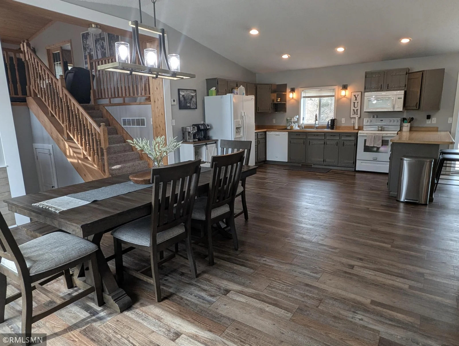 Stairs lead to lofted living room