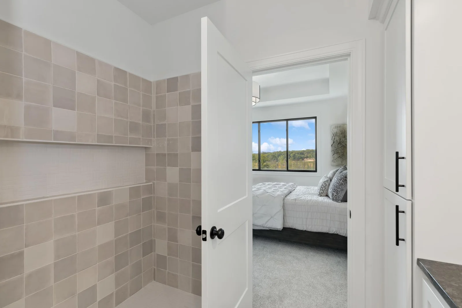 Tile walk in shower in the master bathroom