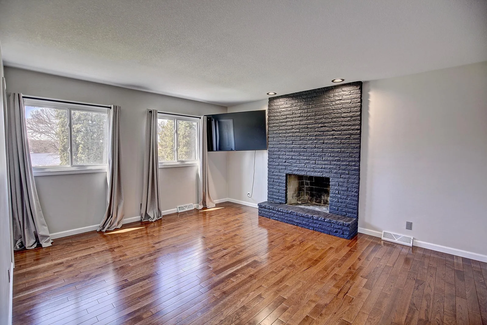 Primary Bedroom with a private bathroom and wood burning fireplace!