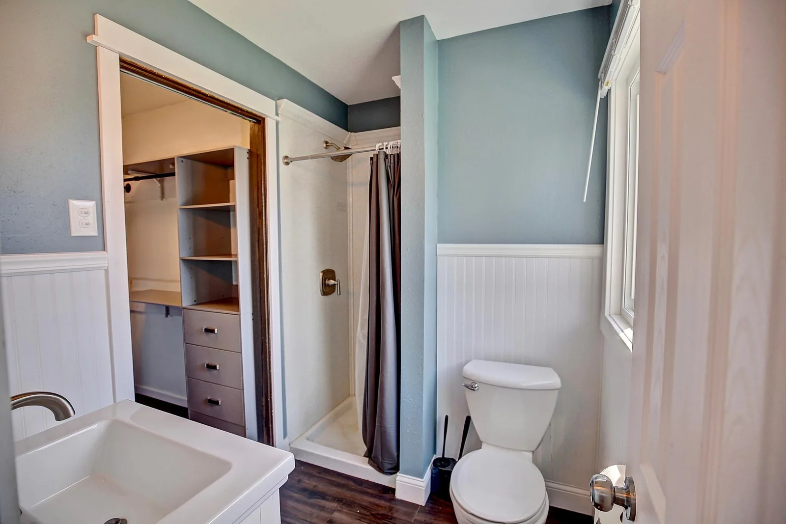 Private primary bathroom with walk in closet