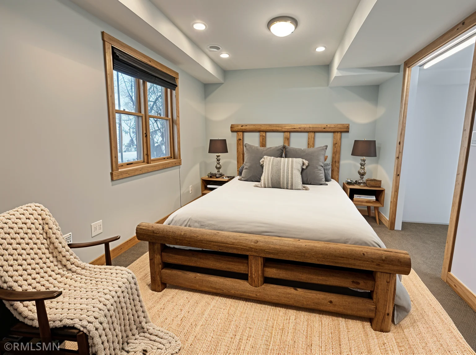 Virtually staged lower-level bedroom.