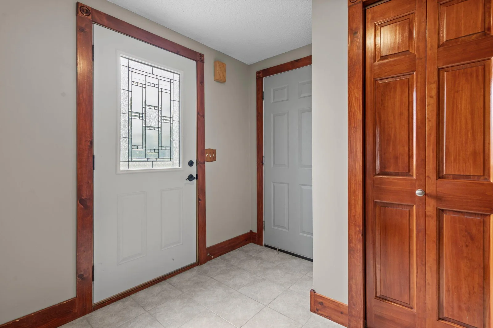 The foyer includes a tile floor.