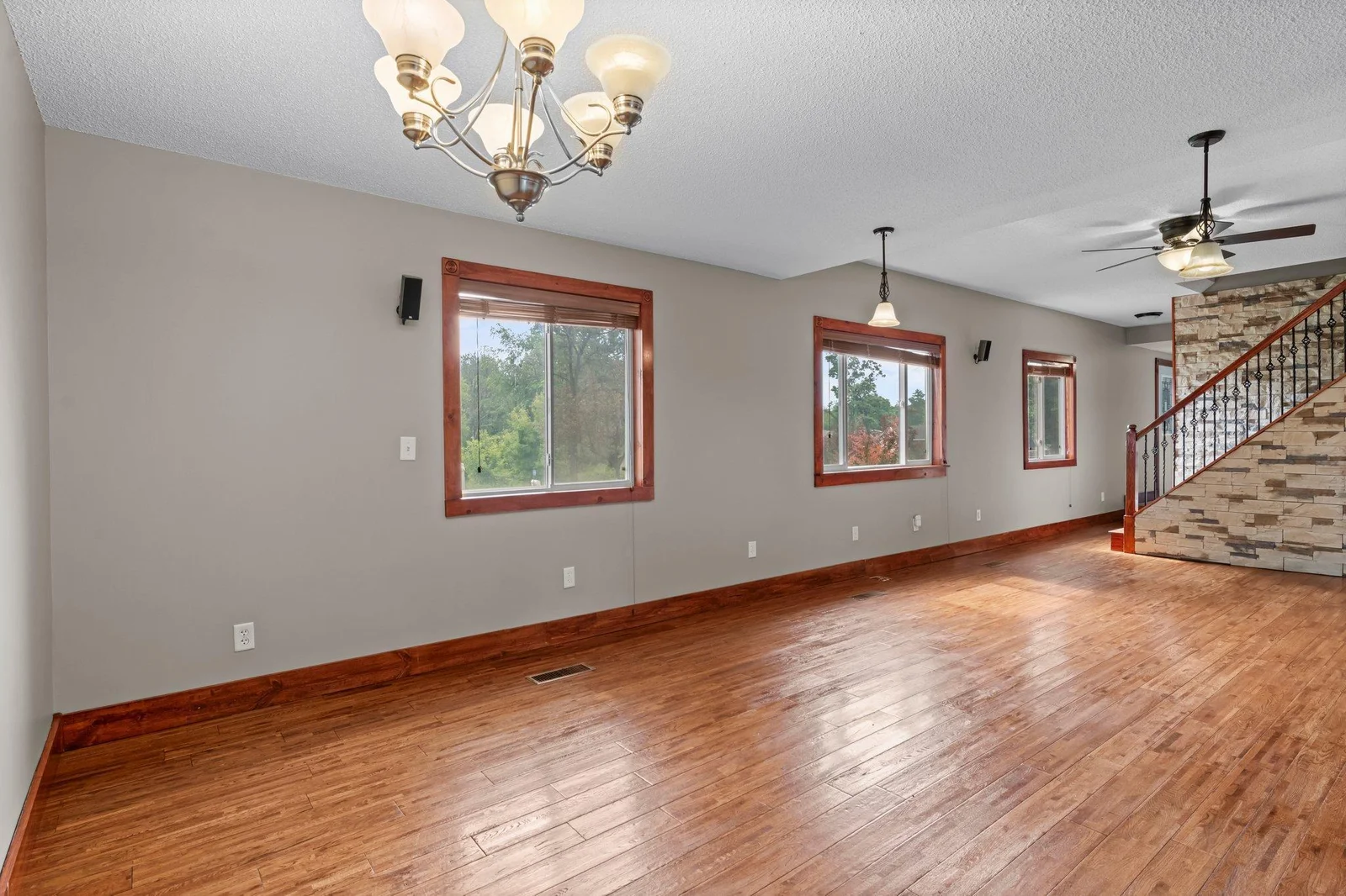 The living room and dining area include beautiful natural woodwork.