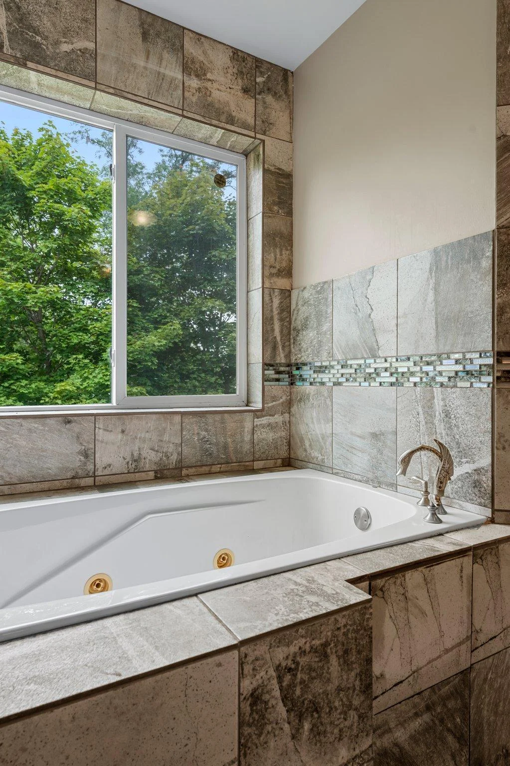The upper level bathroom includes a jetted tub.