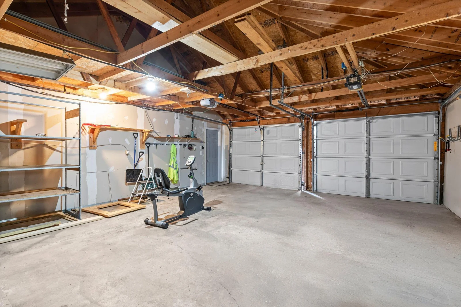 The two-car garage has been sheetrocked.
