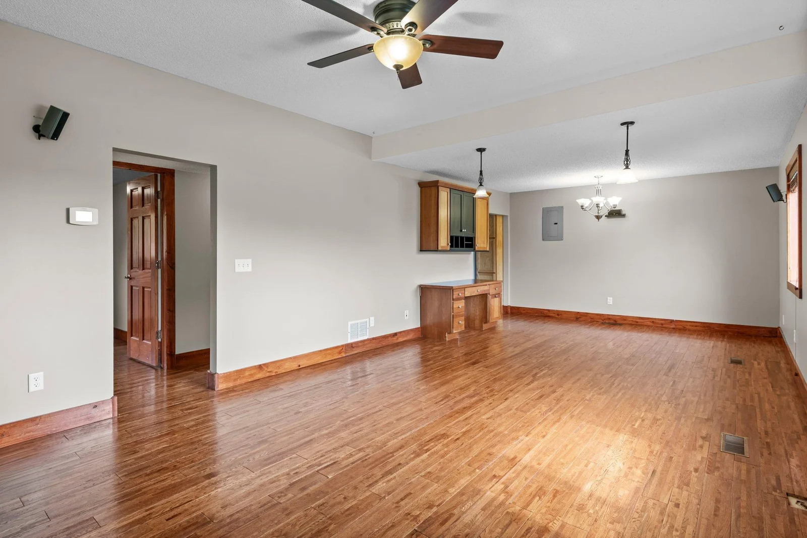The main floor includes beautiful hardwood floors and gorgeous wooden trim and paneled doors.
