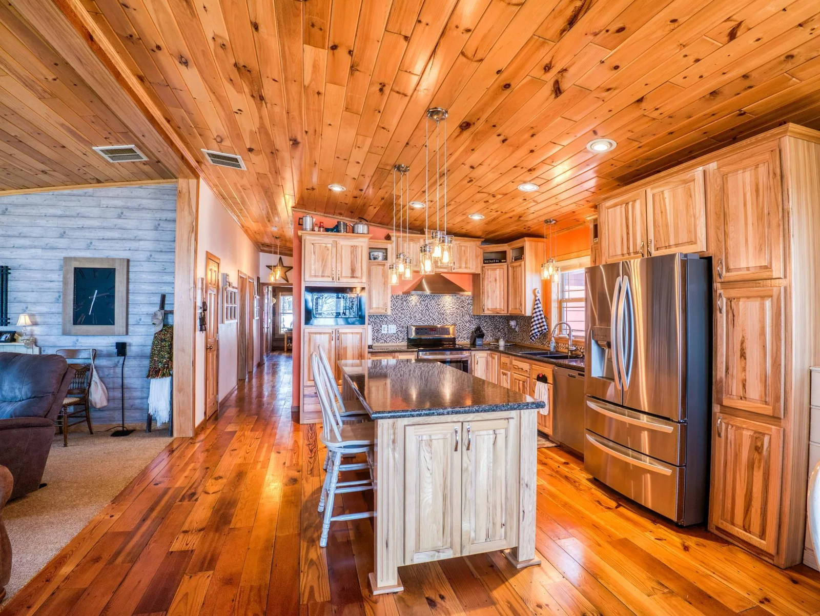 The kitchen features custom cabinetry