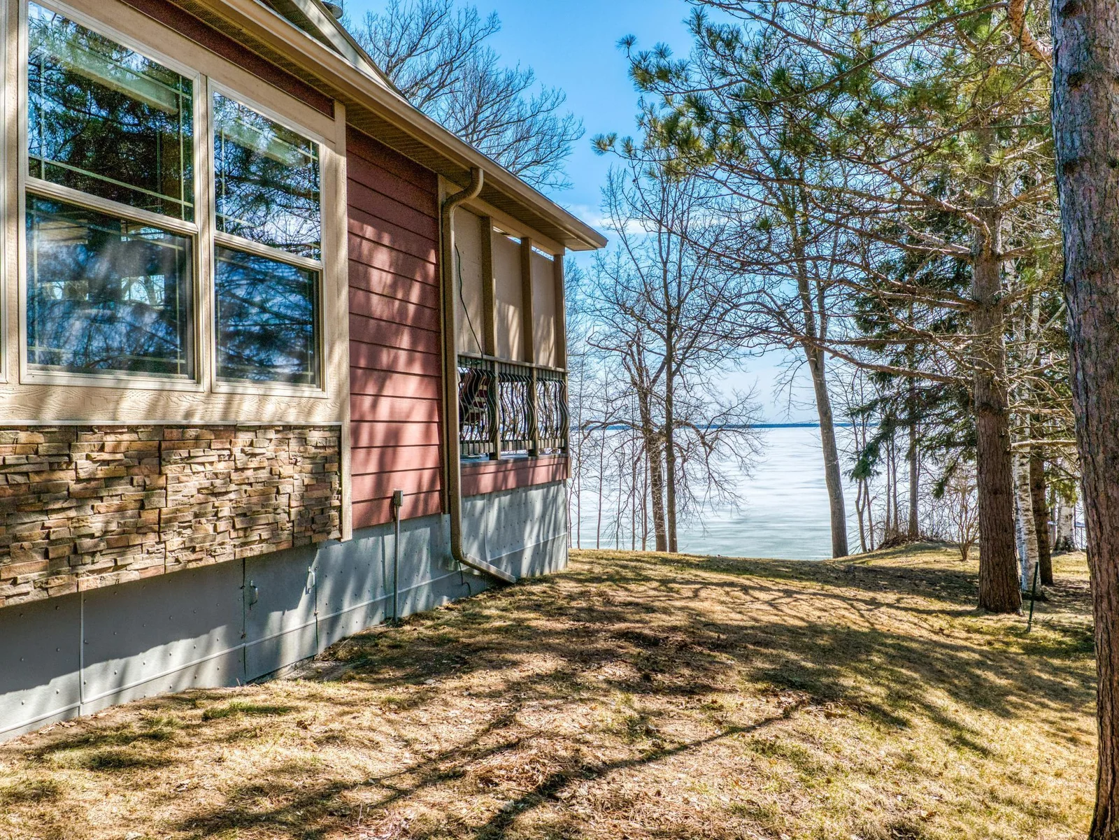 The home is perched just a few feet from the waters edge