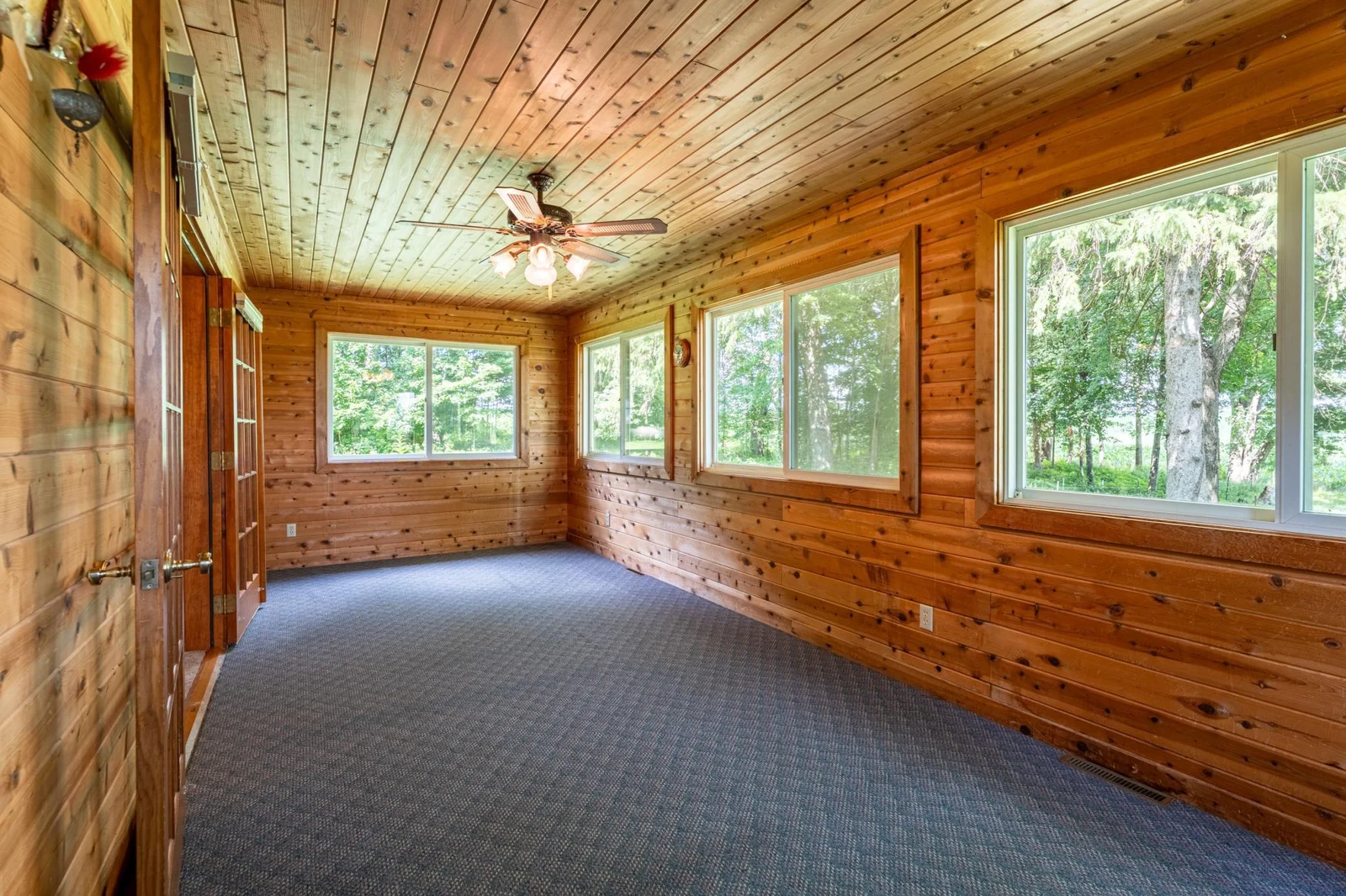 The pine-lined four-season sunroom is a great second living space.