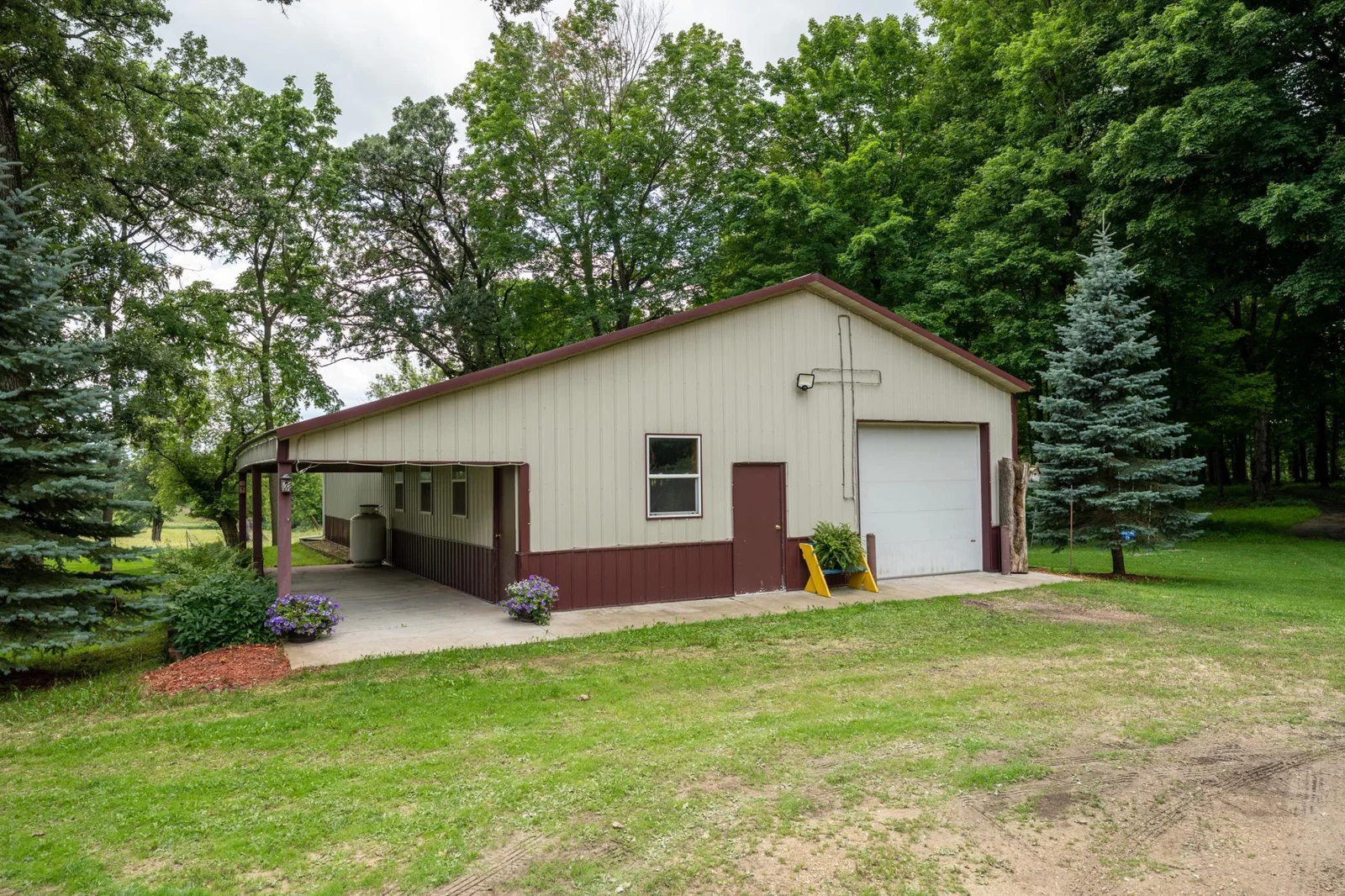 2011-built shed (32x64) offer functional outbuilding space, with a heated and insulated workshop (31x11), the shed has a concrete section for equipment (31.5x21) and a gravel section for animals (32x32).