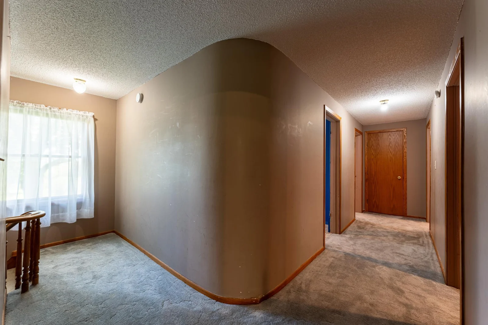 Check out that unique curved wall in the upstairs hallway!