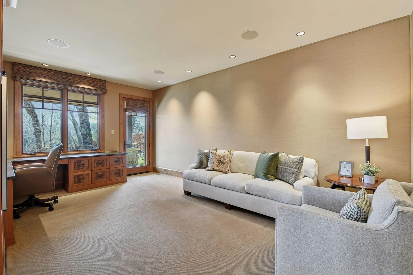 Main floor office with walk-out access to patio; conforming bedroom space