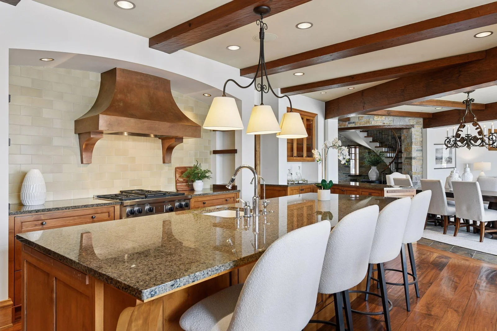 Large center island is ideal for meal prep, quick bite to eat, and laying out a buffet when entertaining