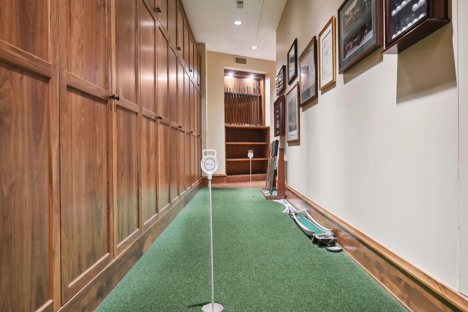 Putting green tucked just around from the golf simulator