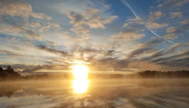 Sunrise and fog on the lake