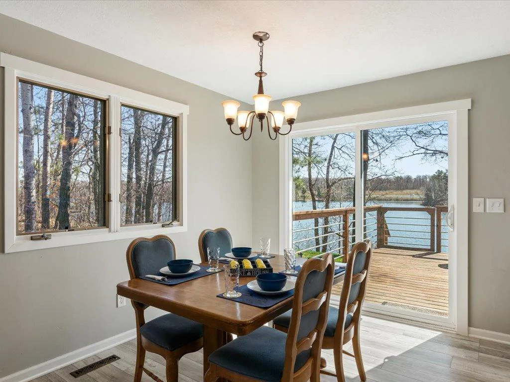 Indoor dining with walkout to generous deck