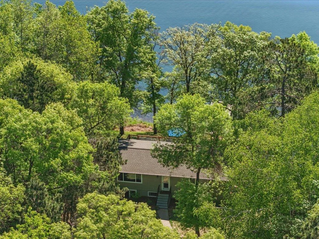 Gorgeous mature tress surround this home