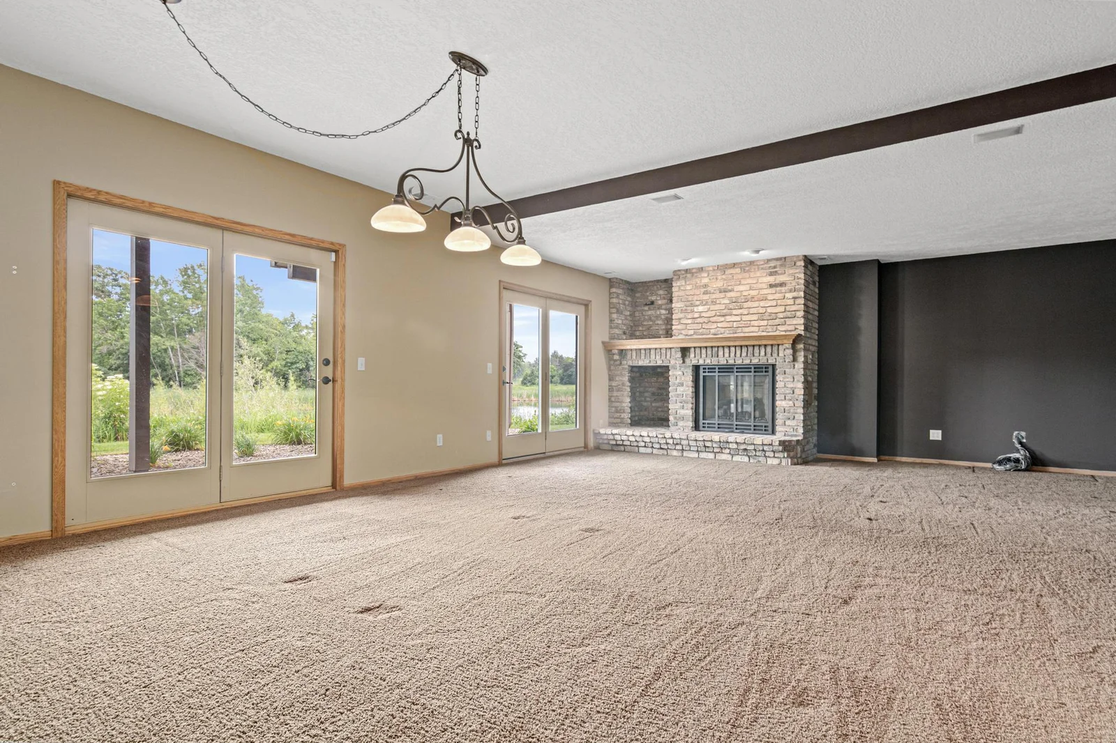 Gas burning fireplace in lower level family room