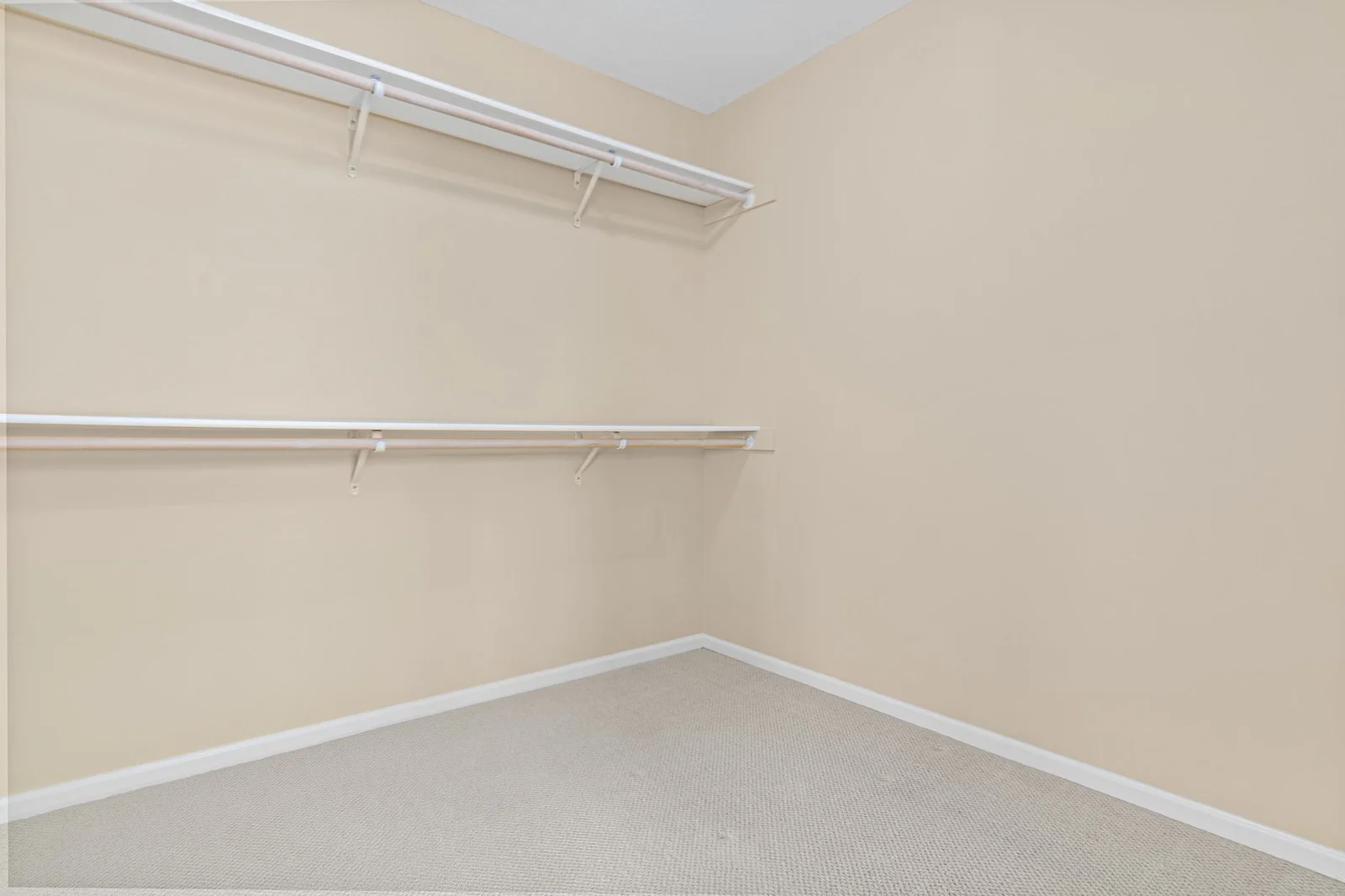 Primary bedroom walk-in closet
