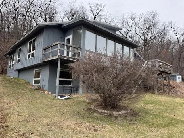 Early spring closeup view of home. Decks have since been refurbished and re-stained.