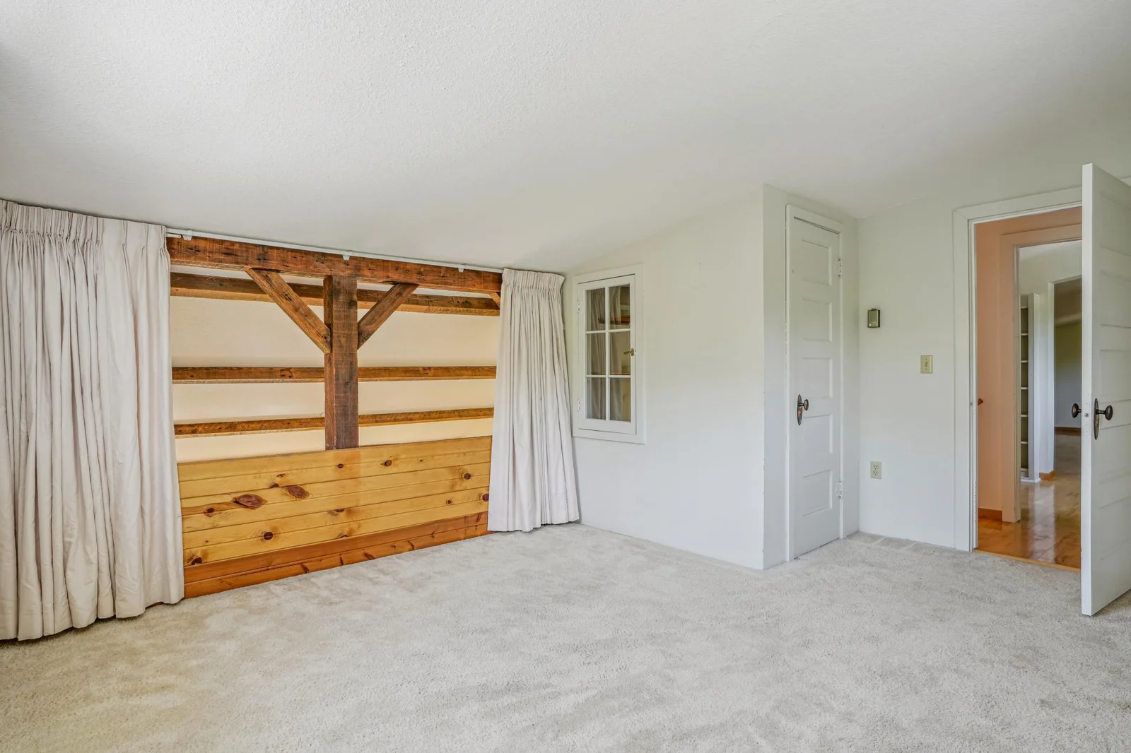 Also on the upper level is a loft bedroom looking down on the main level living area.