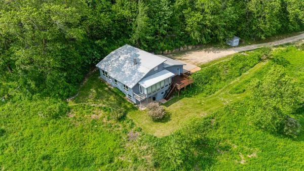 Home sits on a site surrounded by mature woods
