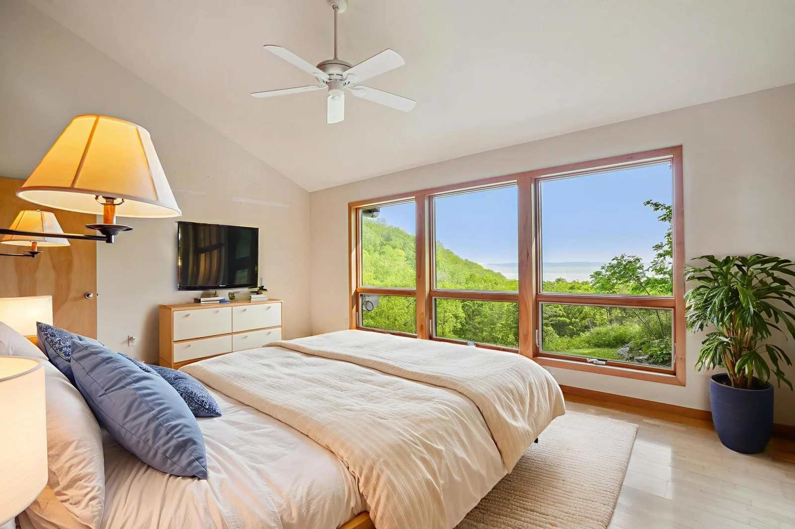 Virtually staged master bedroom. Note the great view.