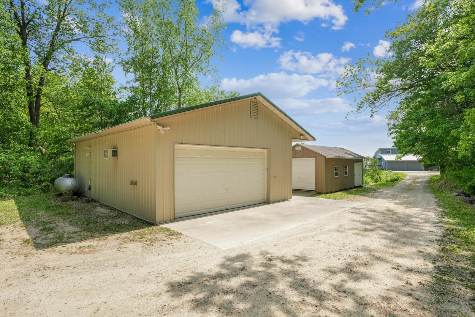 This detached building includes a large garage, workshop, and office area. All heated and cooled.