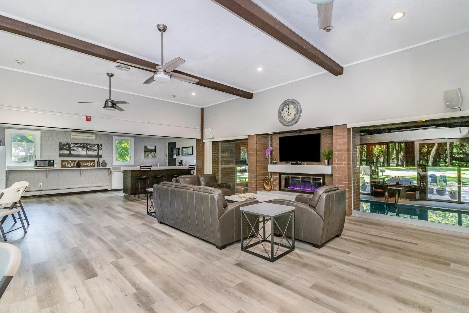 The building's party room is available for residents and includes a kitchenette, big-screen TV, fireplace and plenty of seating.