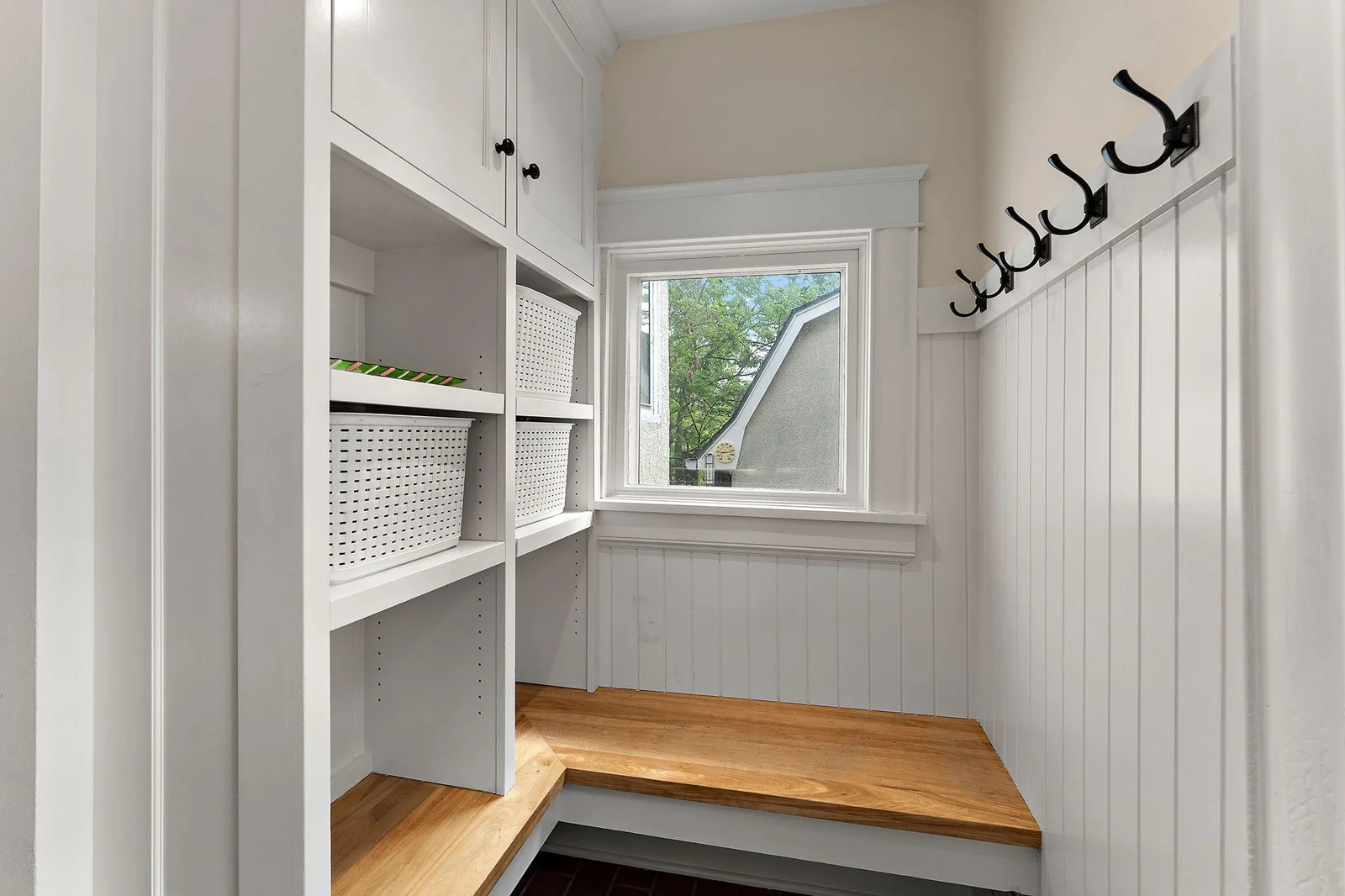 The rear mudroom/drop zone from garage door.
