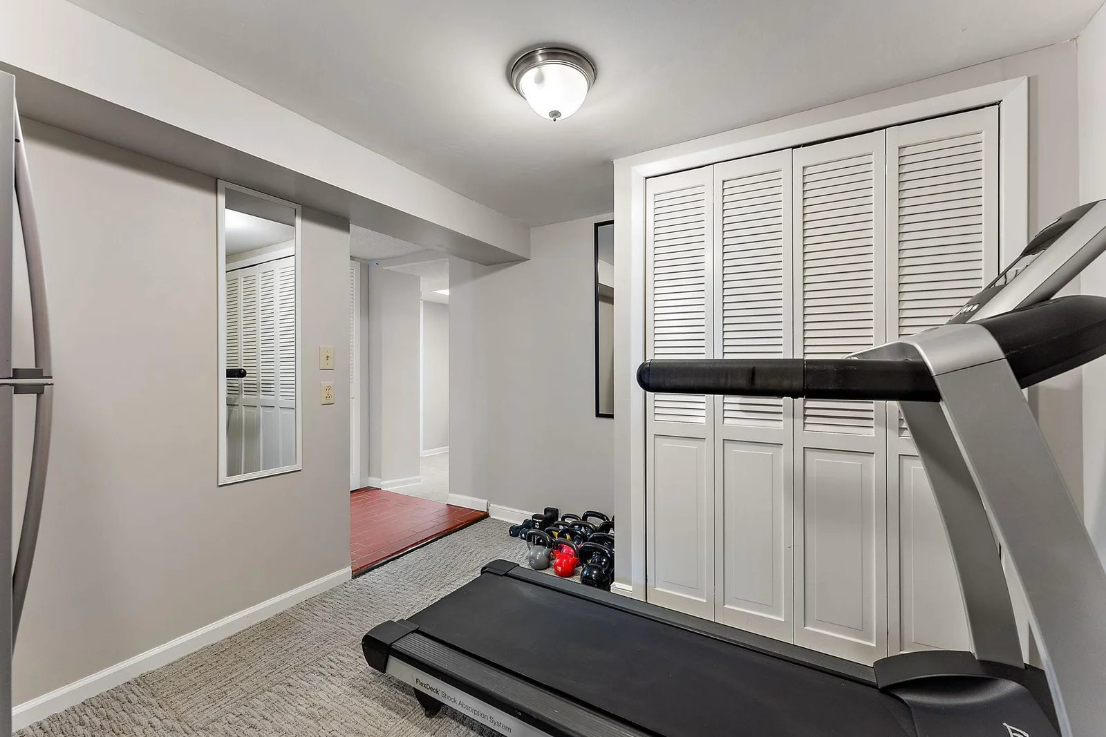 A view of the gym or office area downstairs.