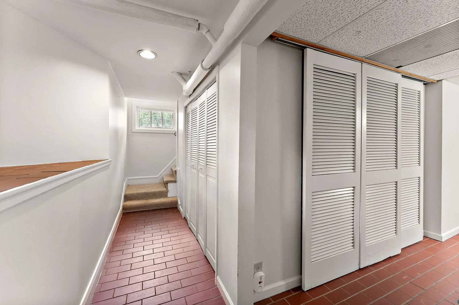 Downstairs hallway in ceramic tile.