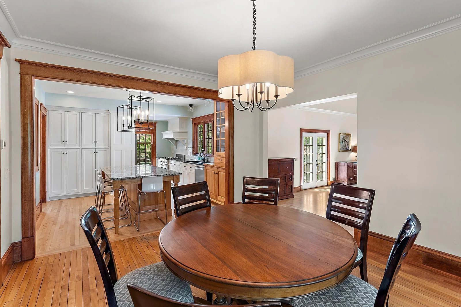 Open concept kitchen, island, dining.