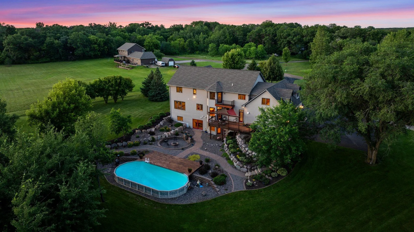 The backyard is an oasis, featuring stunning landscaping and a pool.
