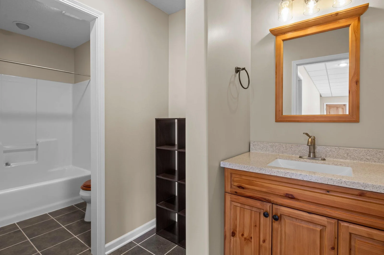 The lower level includes a full bathroom.