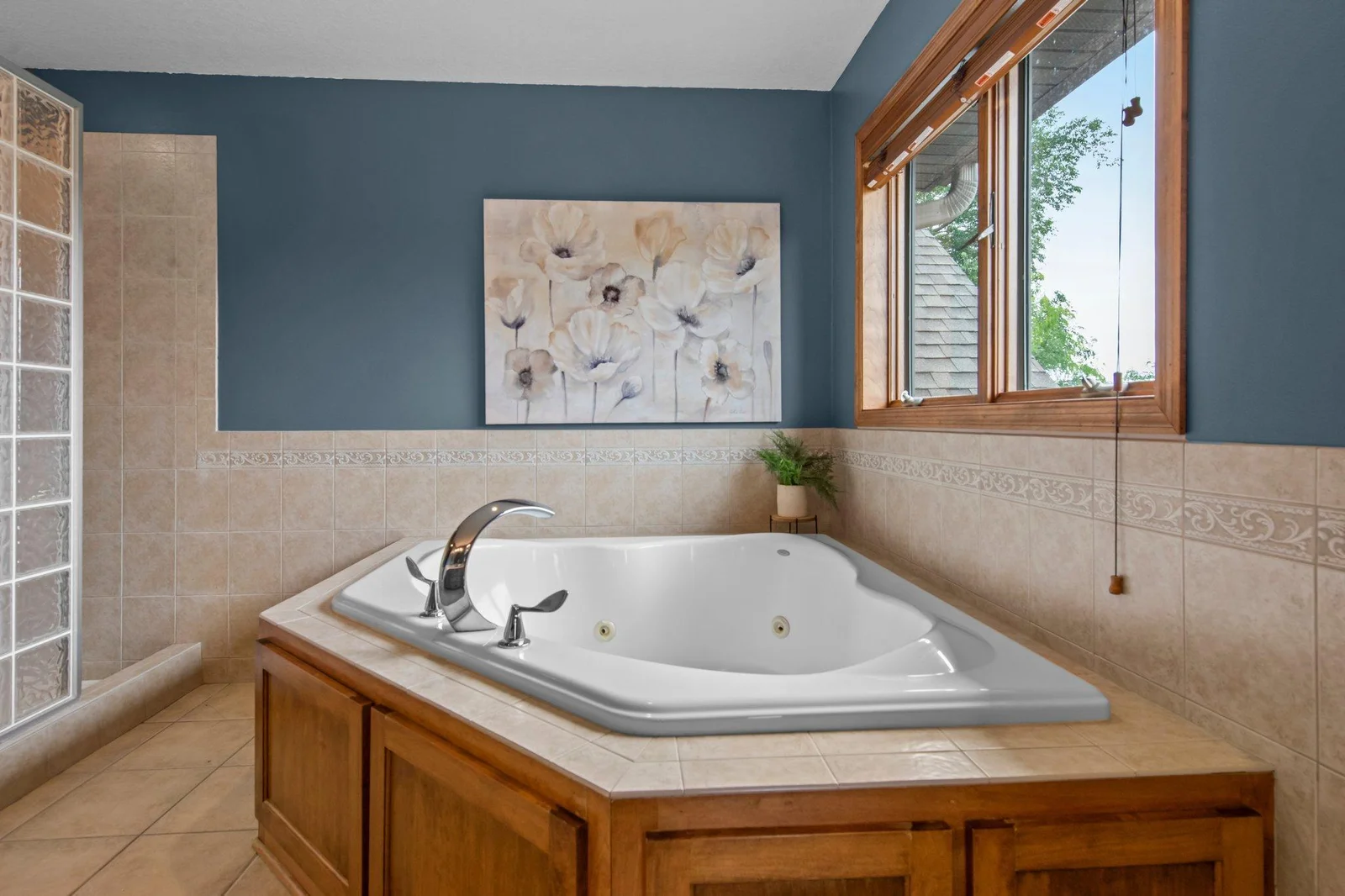The primary ensuite bathroom features double sinks, a jetted tub and a separate shower.
