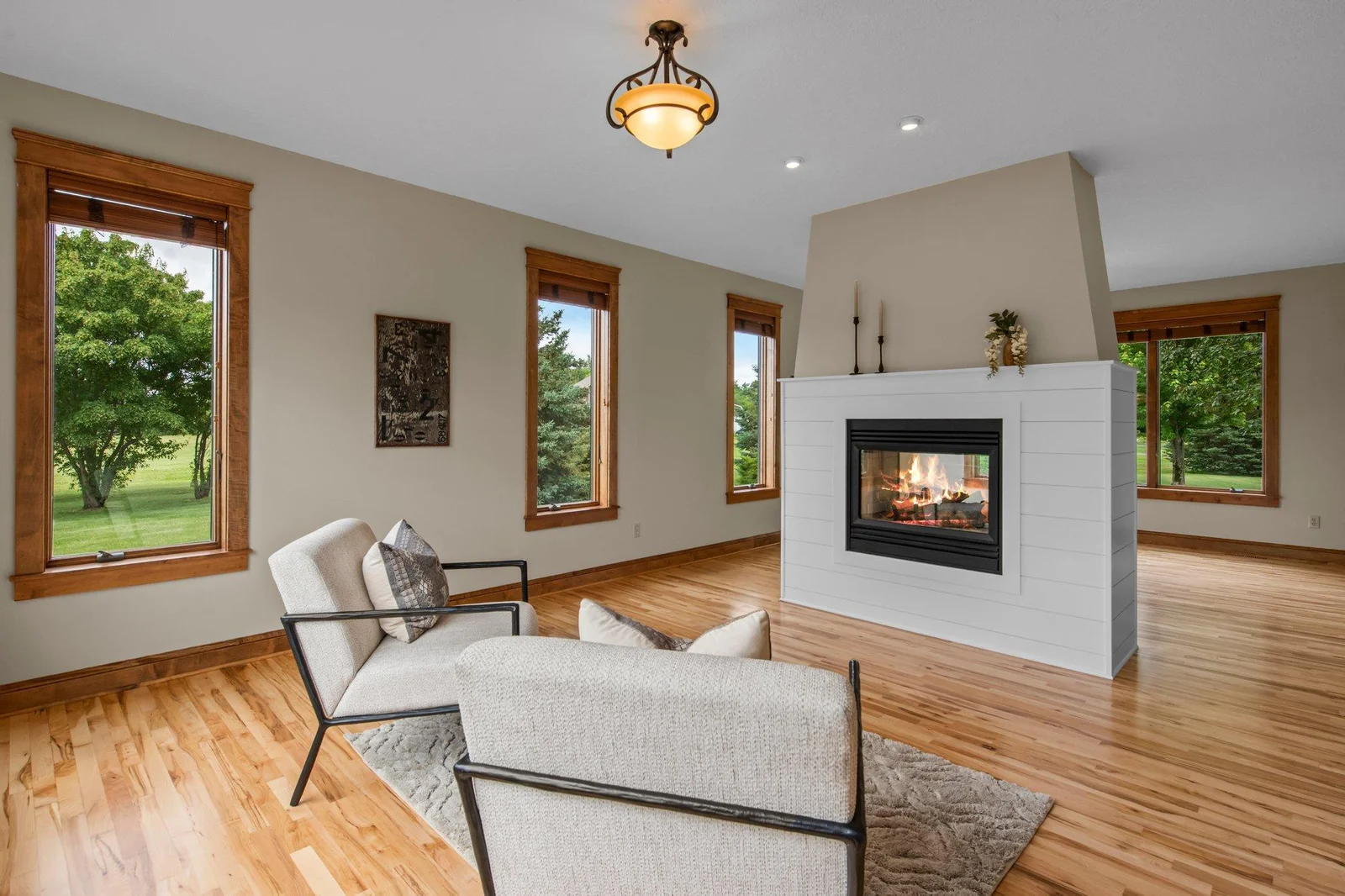 The double sided fireplace is the perfect centerpiece for this home.