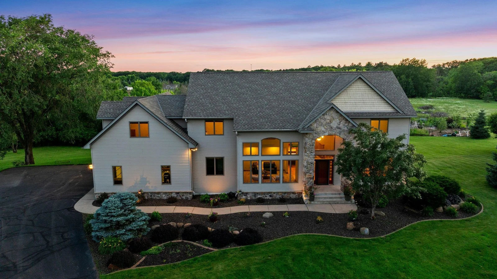 This home is surrounded by breathtaking landscaping.
