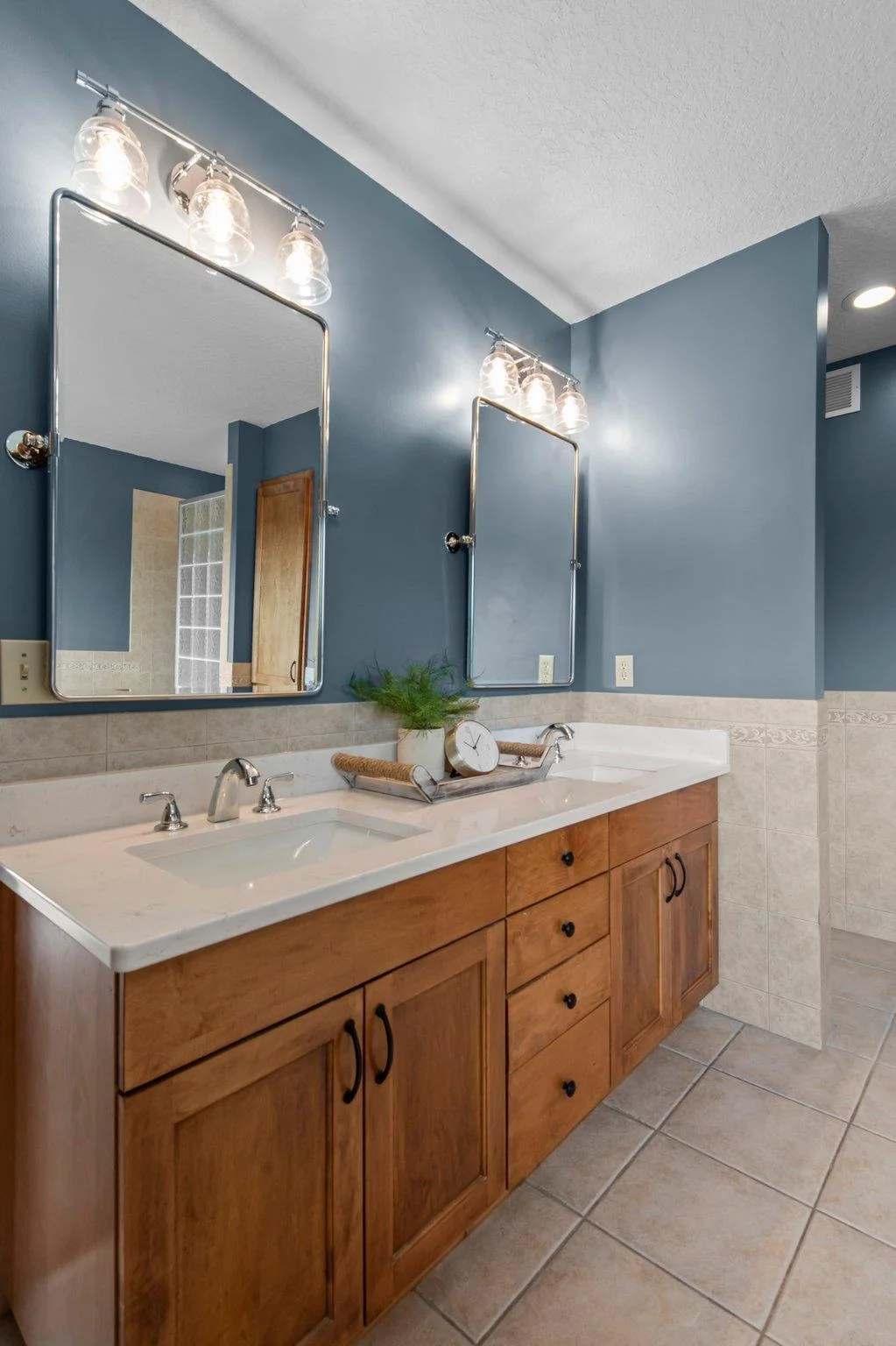 The primary ensuite bathroom features double sinks, a jetted tub and a separate shower.