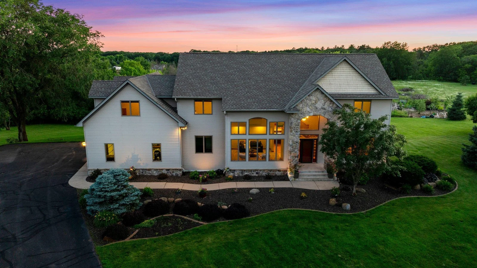 This home is surrounded by breathtaking landscaping.