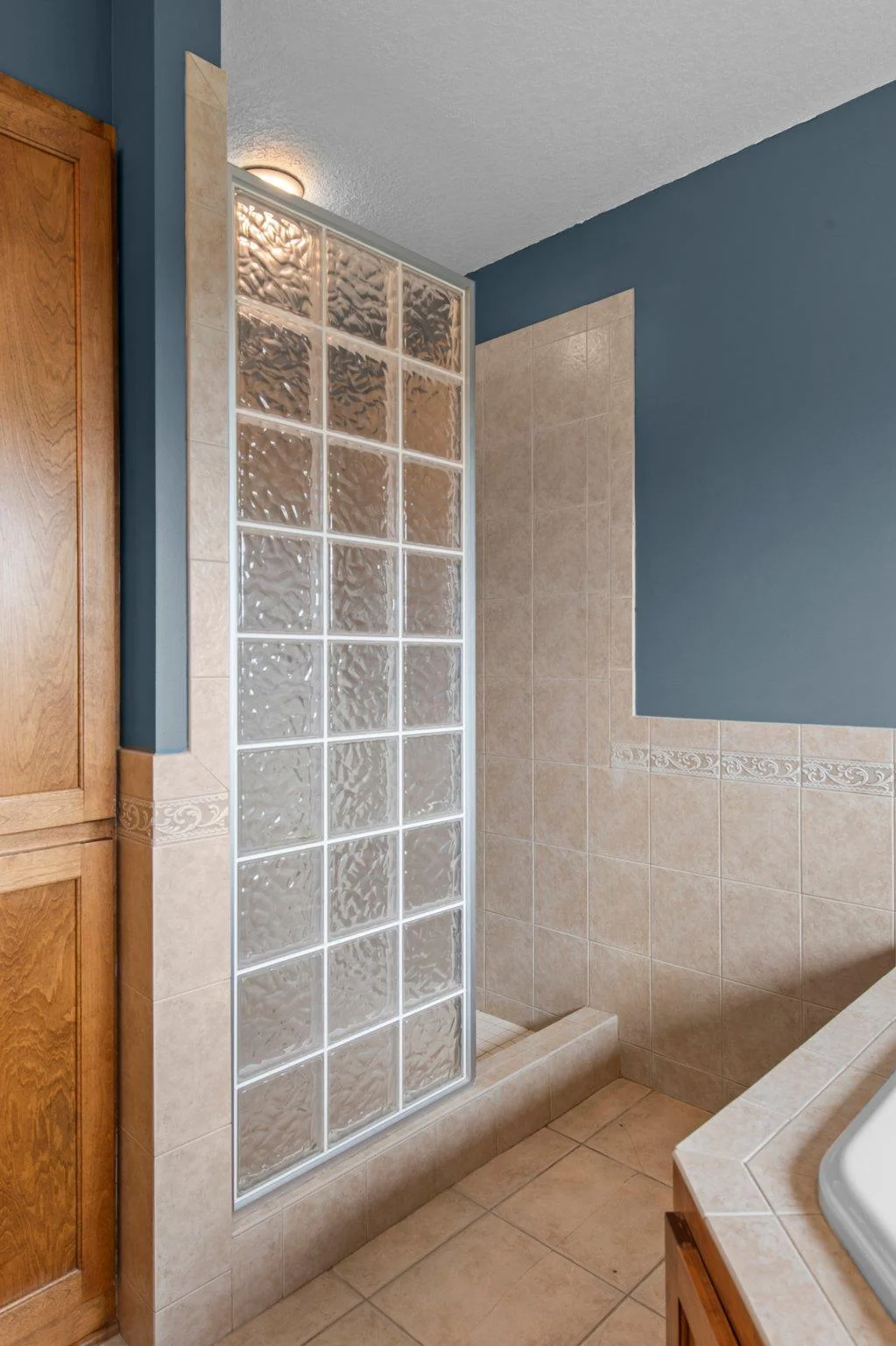 The primary ensuite bathroom features double sinks, a jetted tub and a separate shower.