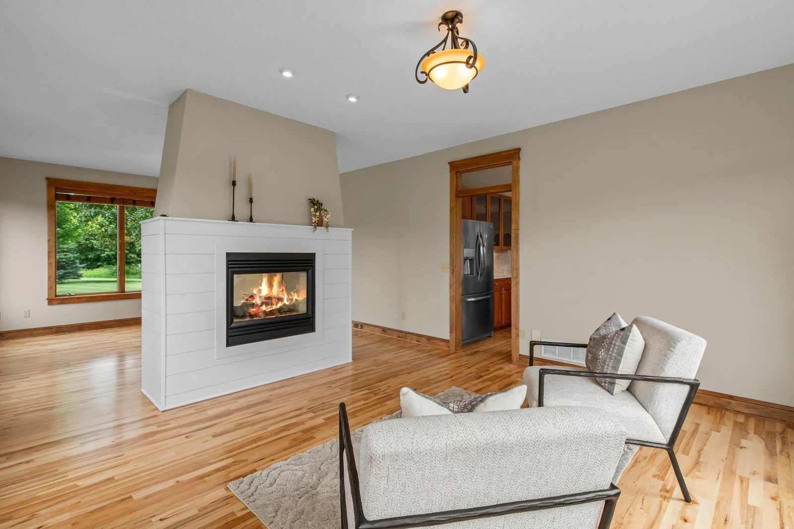 The double sided fireplace is the perfect centerpiece for this home.
