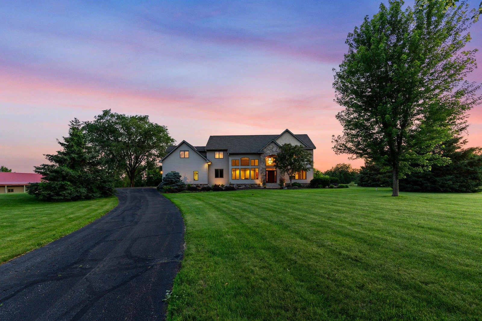 This 6-bed 5-bath stunner also offers a pool and a pole building on its 15 acres.