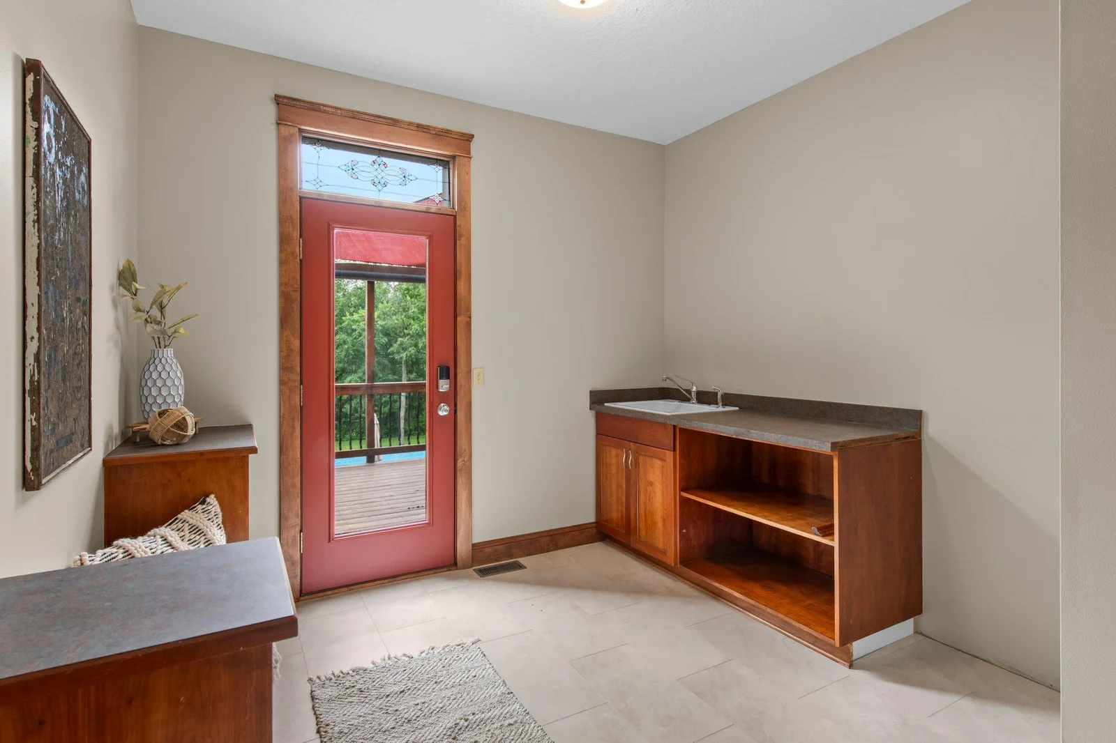 The mudroom is accessible from both the garage and the deck.